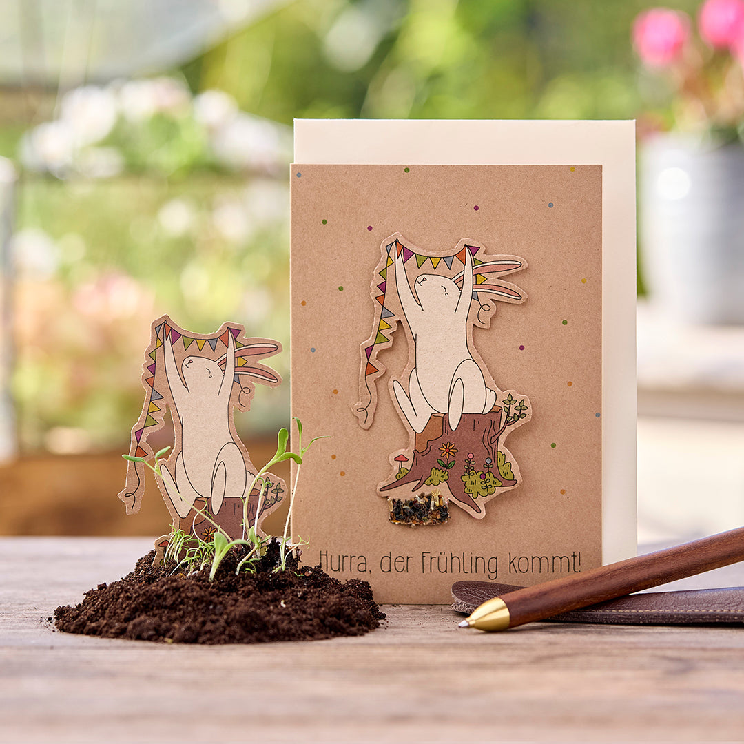 Osterkarte 'Hurra, der Frühling kommt' mit bunten Frühlingsmotiven